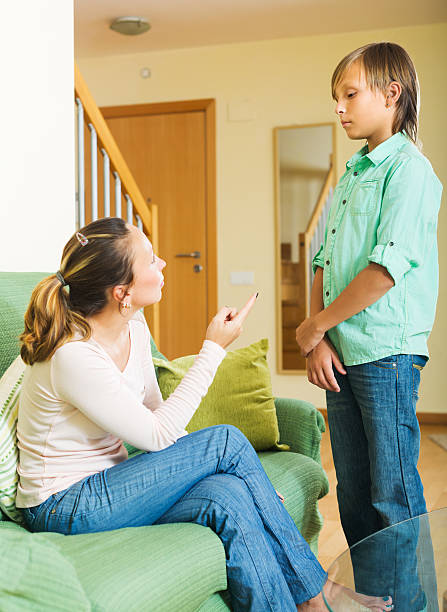 istock Mother berating teenager son 480598660