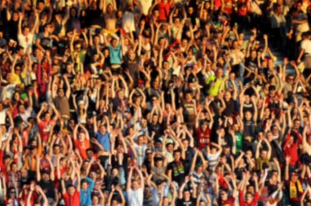 istock Crowd of people with raising hands 480599438