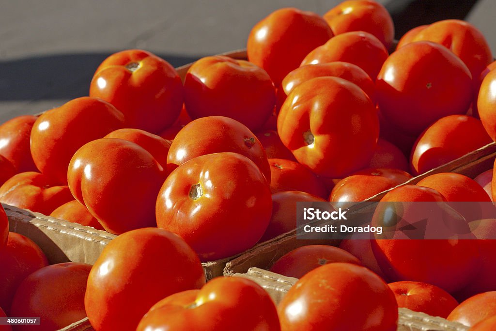 Close Up of Tomatoes Close up of Bushels of Tomatoes at Farmers Market Dieting Stock Photo