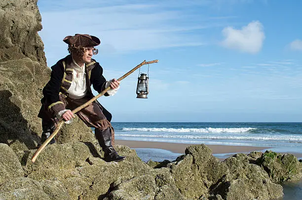 Photo of Mature man dressed as a pirate in a traditional costume