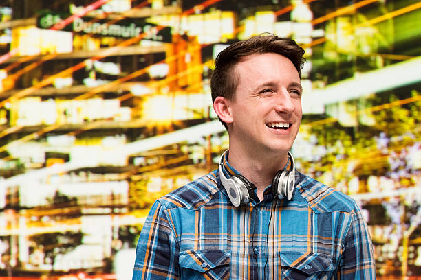 istock Smiling casual man outdoors at night in the city 480606206