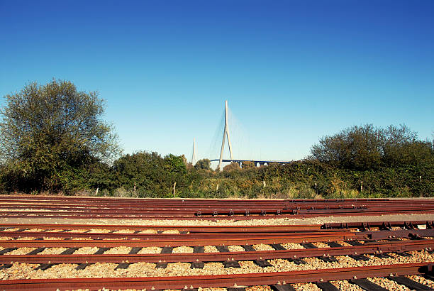 The Pont de Normandie is a cable - stayed bridge over the Seine River connecting Le Havre with Honfleur , France.