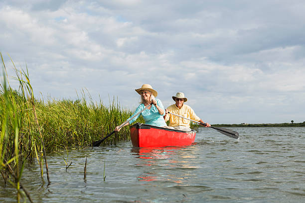 istock Senior couple canoeing 480607161