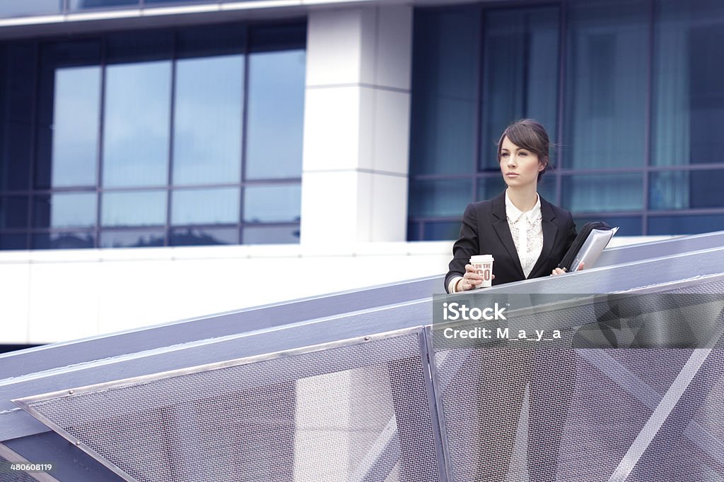 Businesswoman  Outdoors Businesswoman in front of a corporate building. Adult Stock Photo