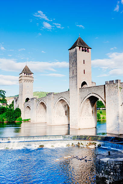 The Valentre Bridge spanning the Lot River at Cahors in France.Built in the 14th century with Gothic arches and square towers, it now only carries pedestrian traffic and has become a major tourist attraction. AdobeRGB colorspace.