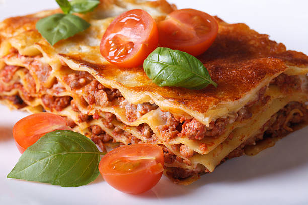 istock Portion of Italian lasagna closeup on a white plate. Horizontal 480609872
