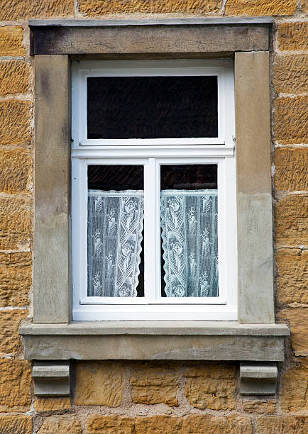 istock old window of a stone house 480611288