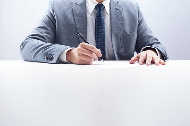 istock Businessman Writing on Paper 480611431