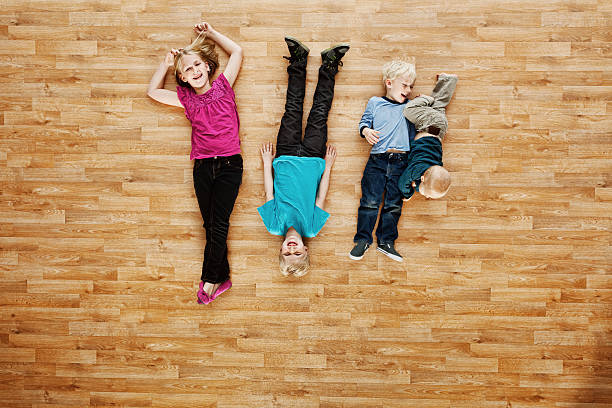 istock Little children lying on the floor 480612221