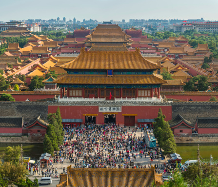 Beijing, China - 1st October 2013: Crowds of tourists during the Golden Week national holiday at the Gate of Divine Might of the Forbidden City, the iconic UNESCO World Heritage Site in the heart of Beijing, China's vibrant capital city. Composite panoramic image created from three contemporaneous sequential photographs.