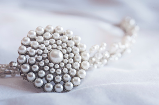 Beautiful pearl tiara on soft white background, taken while the bride gets ready for the wedding.