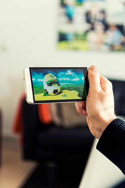 istock Watching Brazil soccer on a mobile phone 480615105