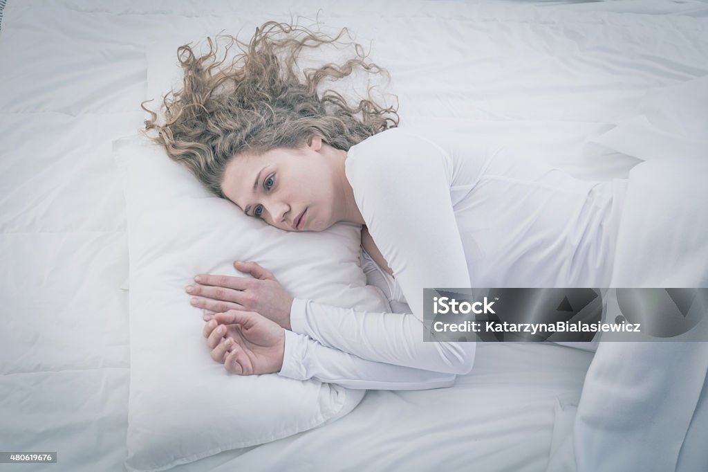 Patient of mental hospital Patient of mental hospital lying in bed 2015 Stock Photo