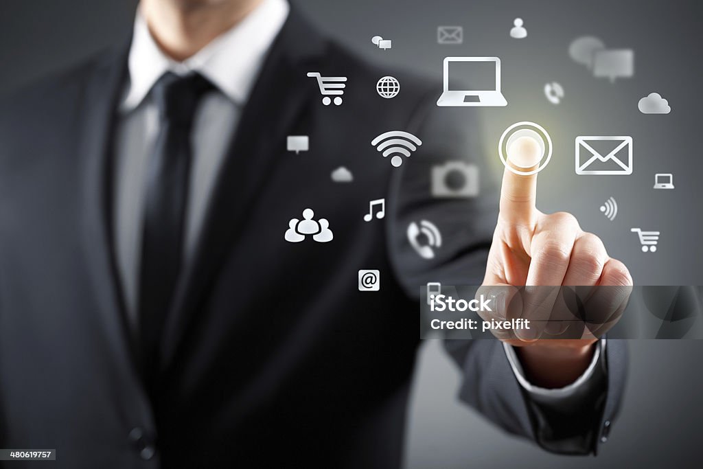 Touch screen concept Businessman touching vusial screen. Adult Stock Photo