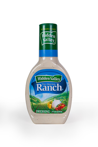 New York City, New York, USA - July 9, 2015: Pictured is a plastic bottle of Hidden Valley Ranch salad dressing against a white background.  This popular brand of American salad dressing was founded by Steve Henson in the 1950's. 