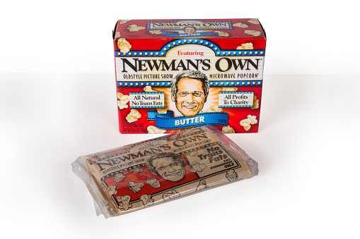 New York City, New York, USA - July 9, 2015:  Pictured is a box of Newman's Own microwave popcorn against a white background.  Founded by American movie actor Paul Newman, Newman's Own brand donates 100% of after tax profits to charitable organizations. 
