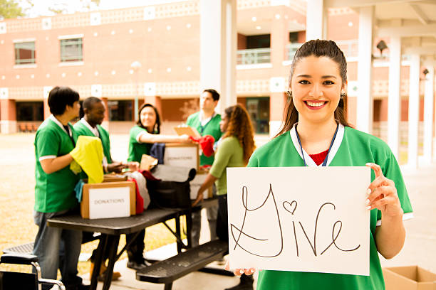 istock Volunteers: College students collect clothing donations for community. 480620687