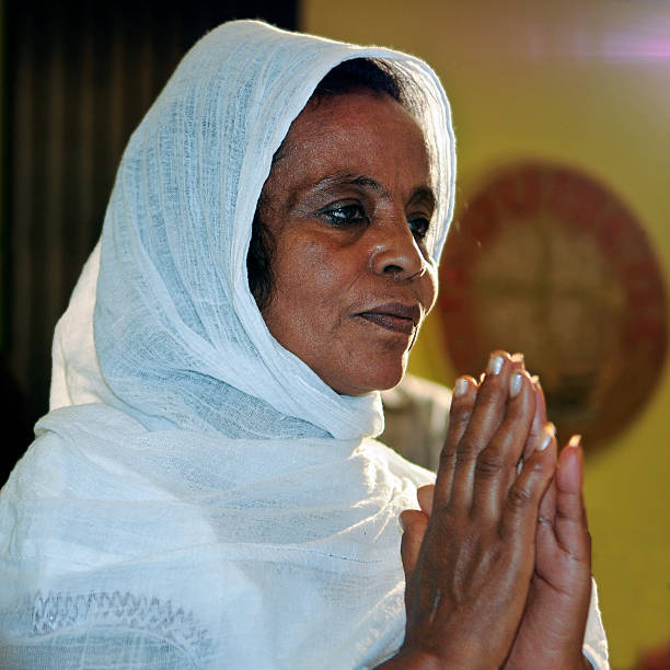 Ethiopian woman in prayer stock photo