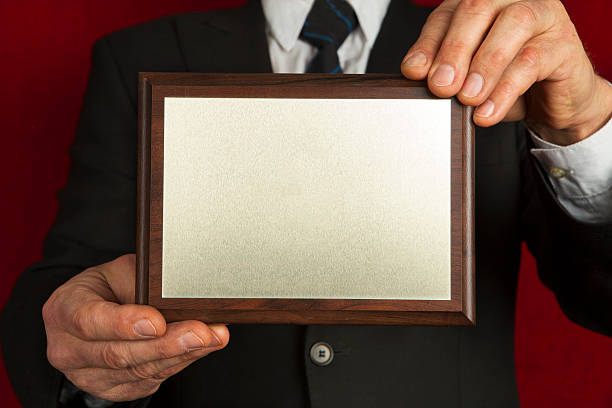istock Memorial plaque in the hands of men 480621331