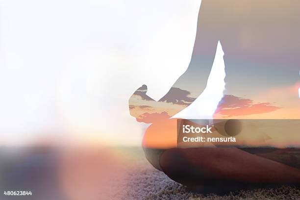 Double Exposure Of Young Woman Practicing Yoga In Nature Stock Photo - Download Image Now