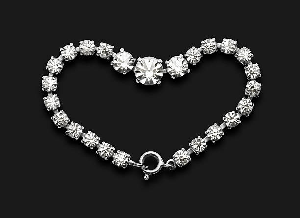 Sparkling heart shaped diamond bracelet isolated on a black background with clipping path