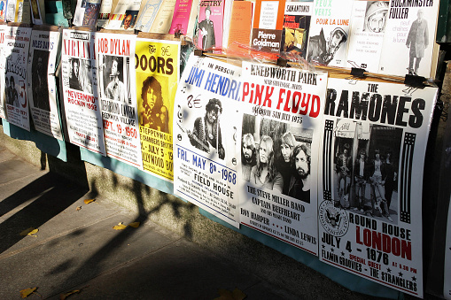 Paris, France - November 15, 2011: Concert posters from 60's and 70's has been exhibiting for selling in a book shop's booth on a street of Paris.