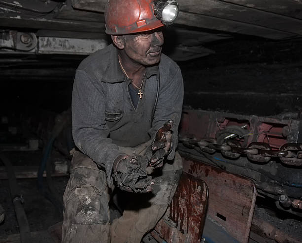 Miner Donetsk, Ukraine - August 16, 2013: Miner repairs coal mining combine donets basin photos stock pictures, royalty-free photos & images