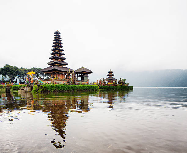 istock Ulun Danu temple pagoda in mist with reflection on lake 480625382