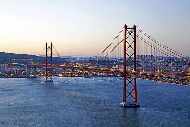 istock 25 Abril bridge in Lisbon Portugal by twilight 480628418
