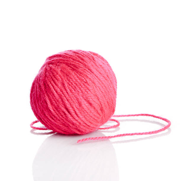 istock Red wool yarn ball isolated on white background 480629340
