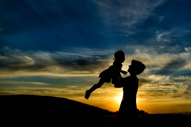 istock happy mother and daughter having fun at sunset 480629430