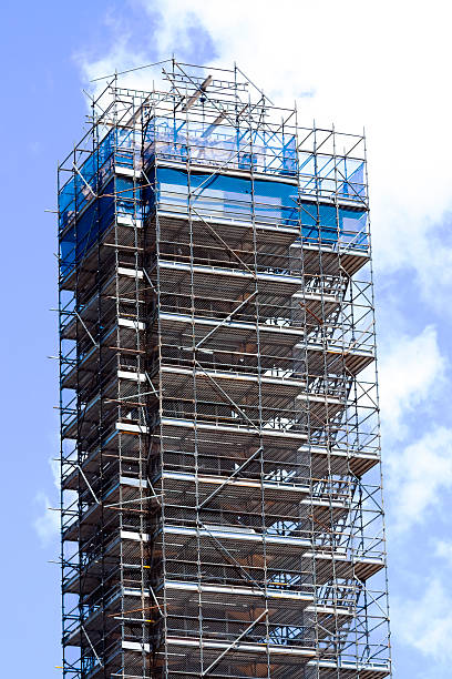 istock Scaffolding on highrise building against sky 480629495