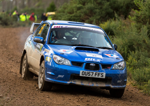 Tain, Ross and Cromarty, Scotland, United Kingdom - February 22, 2014: This is one of the cars in the Snowman Rally part of the Scottish Rally Championship at Stage 5 within Scotsburn Forrest, Tain, Ross and Cromarty, Scotland on 22 February 2014.