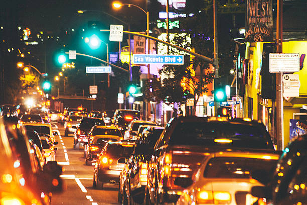 Traffic jam on Sunset Strip. Los Angeles, CA, USA - February 14, 2014: Busy night on Sunset Strip, cars moving slowly in traffic jam. sunset strip stock pictures, royalty-free photos & images