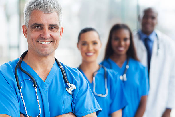 istock senior medical doctor and team 480632323