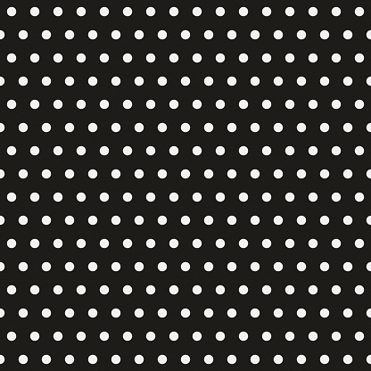 Seamless white polka dot pattern on black textured paper
