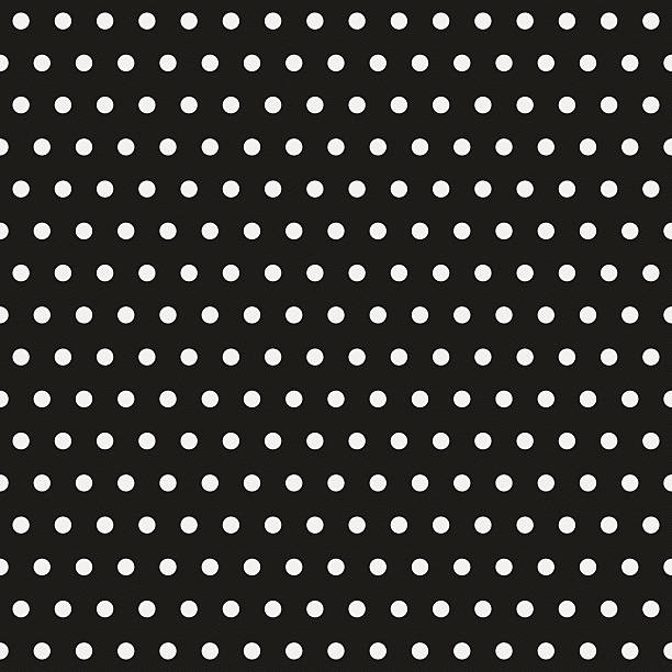 Seamless polka dot pattern on black paper stock photo