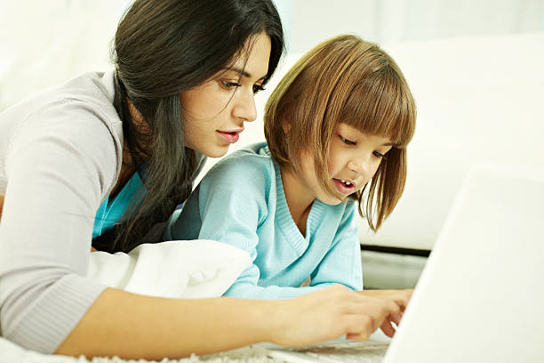 istock Surfing the net with mother 480635415