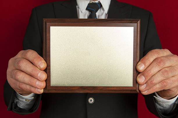 istock Memorial plaque in the hands of men 480637747