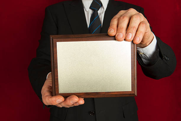istock Memorial plaque in the hands of men 480637749