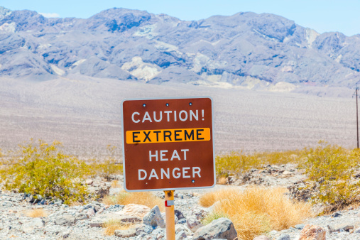 road sign in Death Valley warning travelers of extreme heat