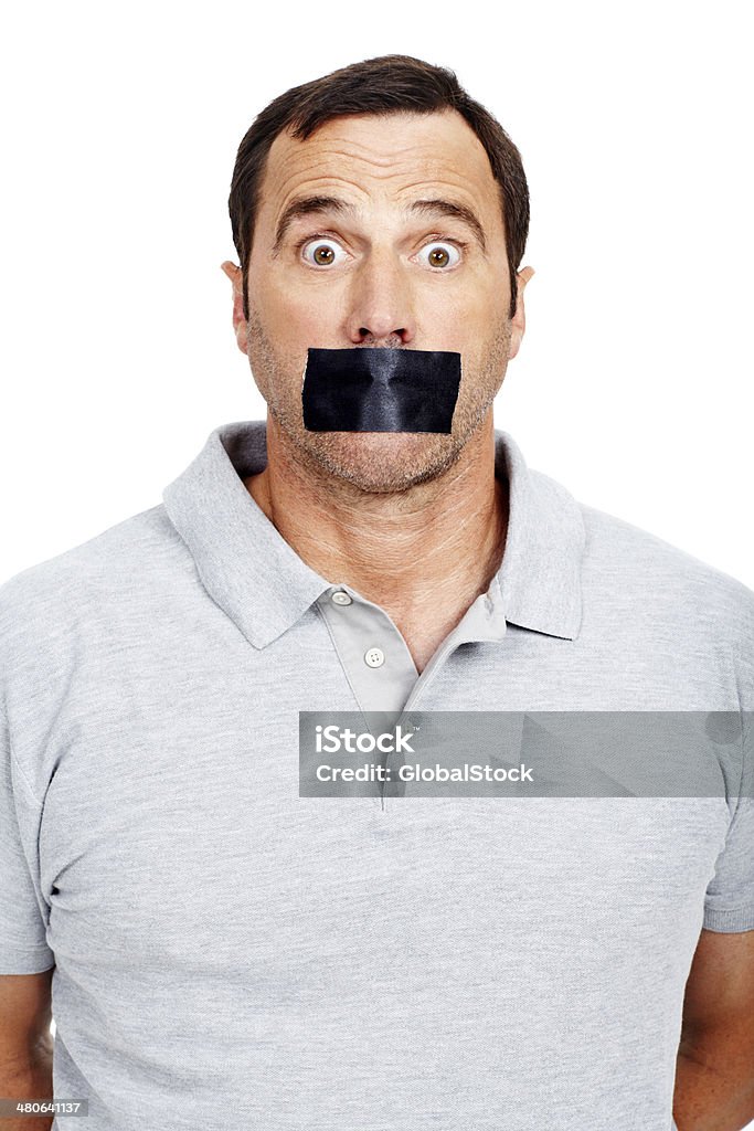 My lips are sealed Surprised mature man with his mouth sealed with tape while isolated on white 30-39 Years Stock Photo