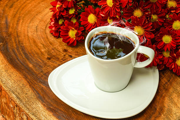 istock Coffee cup and beans on a wood background. 480641277