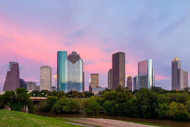 istock Houston Texas  skyline at sunset twilight from park lawn 480641318