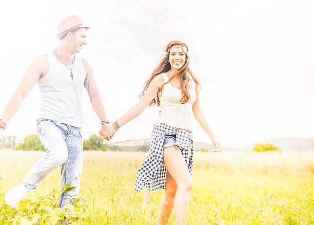 istock Happy smile hipster couple in field 480644352