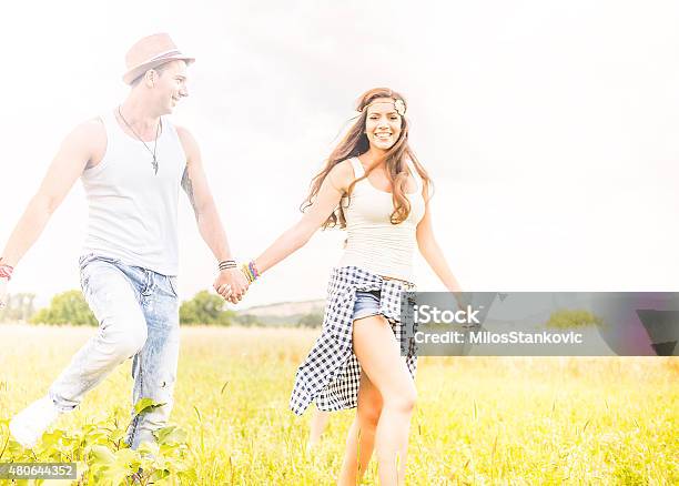 Happy Smile Hipster Couple In Field Stock Photo - Download Image Now - 2015, Adult, Adults Only