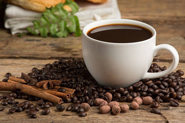 istock Coffee cup and coffee bean on a wooden table 480647464