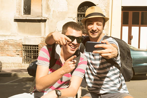 istock Couple of guys doing a selfie. 480647526