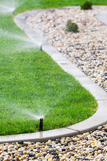 Sprinklers Automatic sprinklers watering lawn agricultural sprinkler stock pictures, royalty-free photos & images