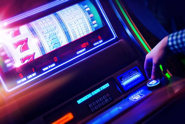 Casino Slot Machine Player Casino Slot Machine Player Closeup Photo. Digital Slot Machine Spin. Playing in Las Vegas Concept Photo. casino photos stock pictures, royalty-free photos & images